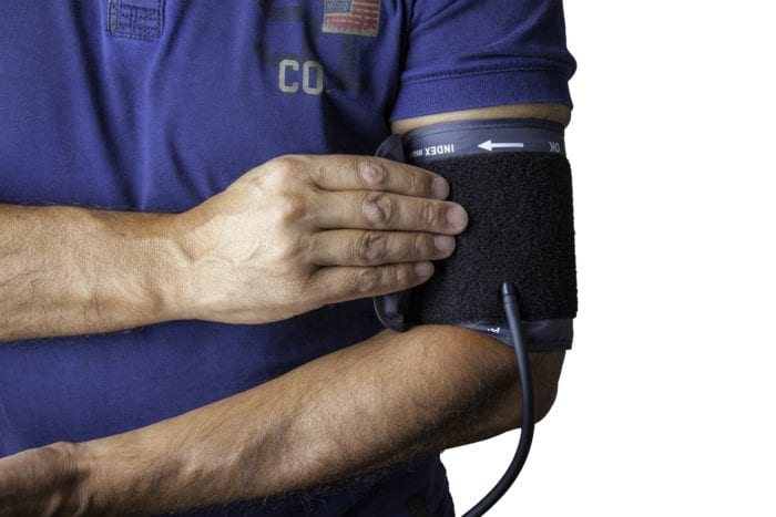 blood pressure cuff on a man