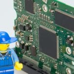 lego man with computer tech