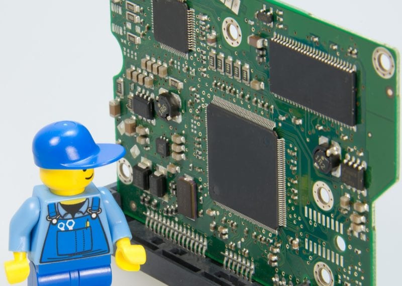 lego man with computer tech